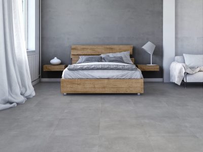 Bedroom with decoration on white hardwood floor in front of empty concrete wall with copy space. Slight vintage effect added. 3D rendered image.